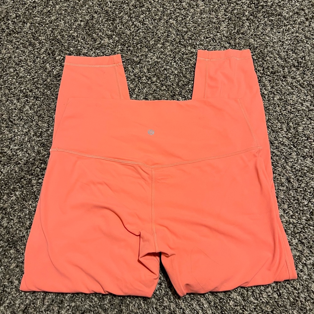 Peach orange Lululemon yoga pants